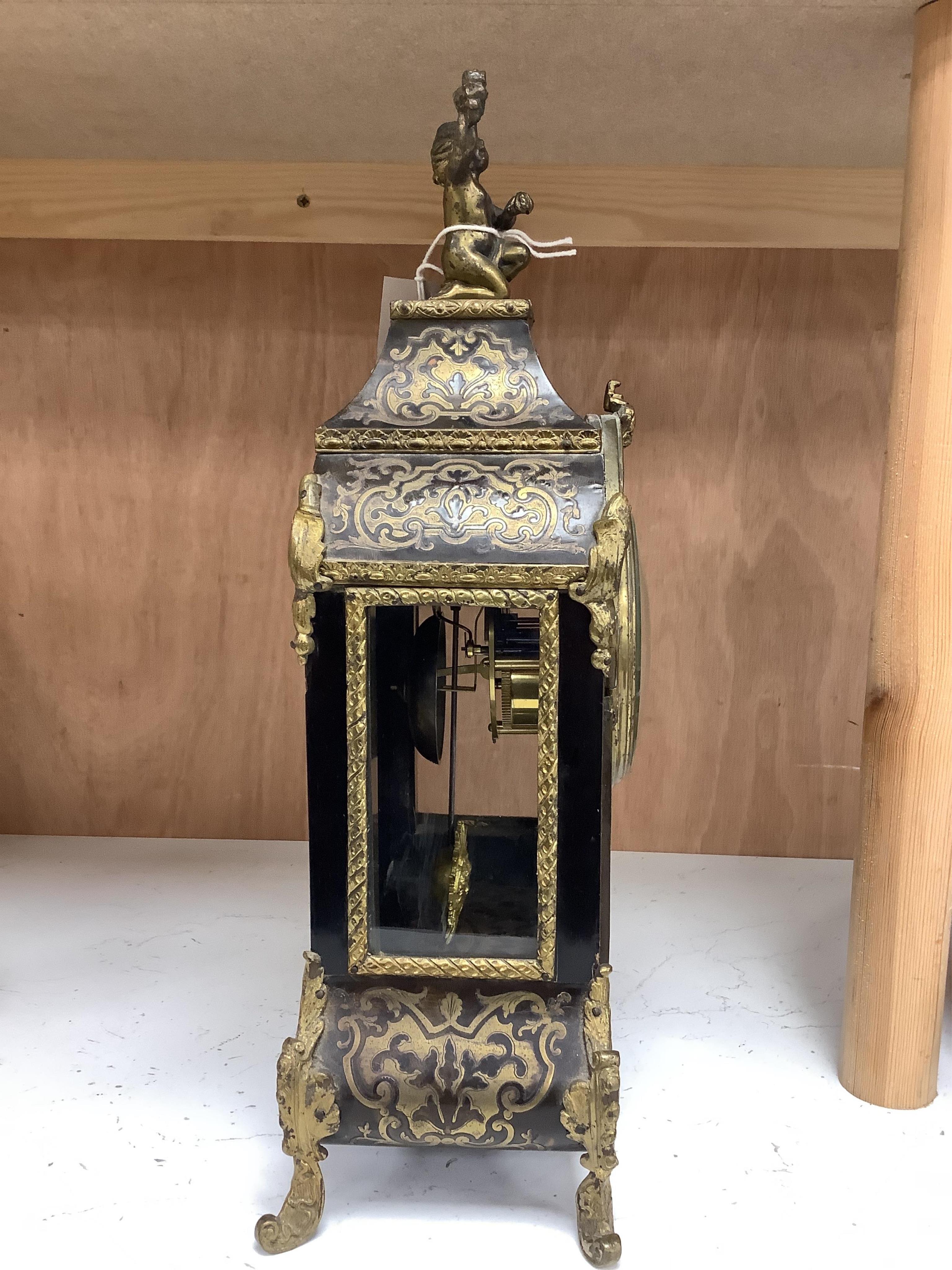 A late 19th century French boulle work mantel clock, with key and pendulum, 40cm. Condition - fair to good, generally worn, not tested as working